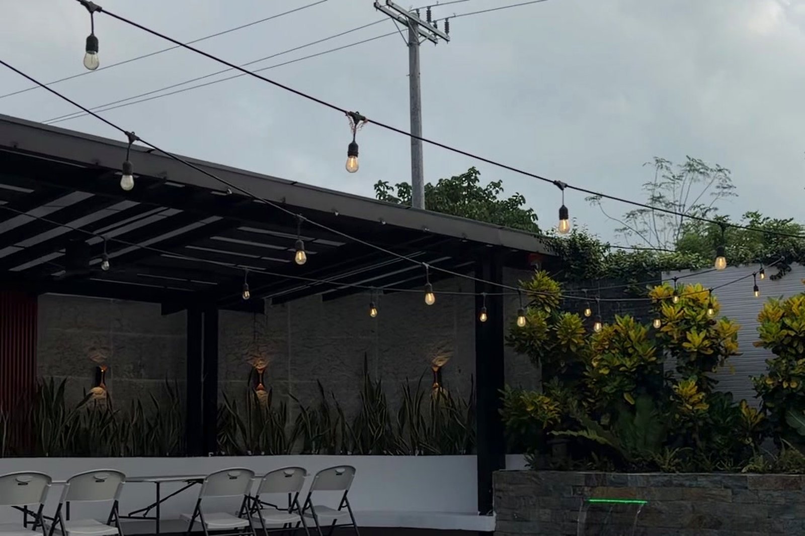 Covered pavilion strung with café lights