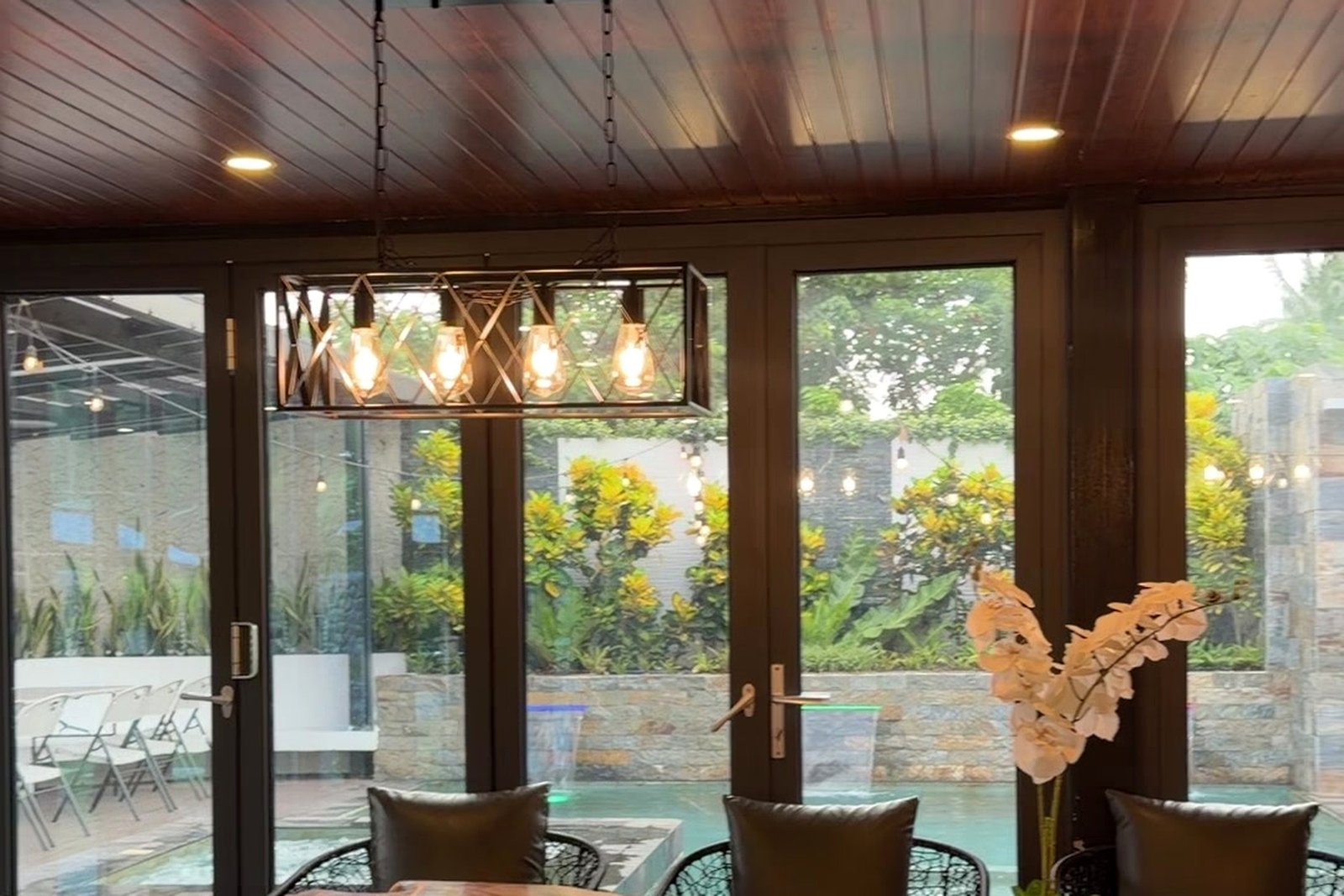 Dining pavilion overlooking the pool and garden wall