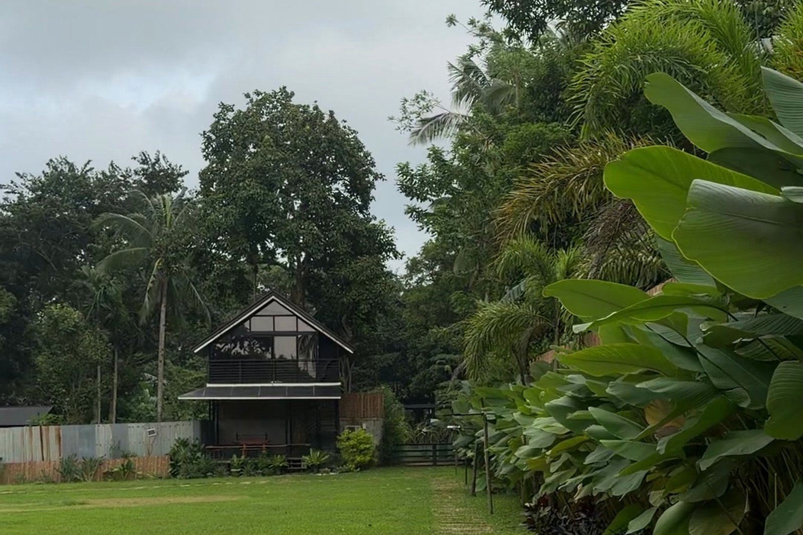 A-Frame villa tucked among coconut palms and garden greenery