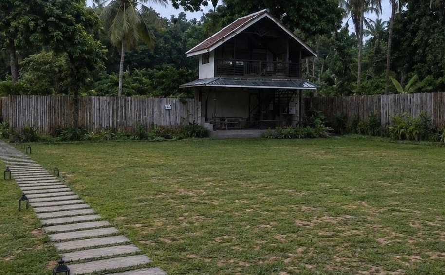 The open lawn, unstyled, with the A-Frame Villa in the background