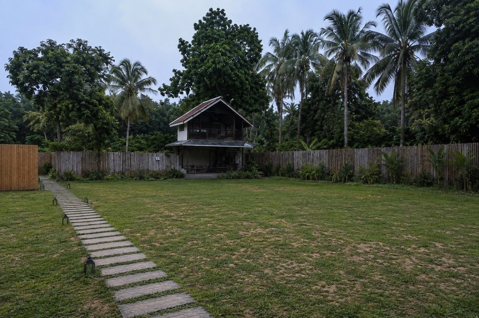 The open lawn, unstyled, with the A-Frame Villa and path in the background